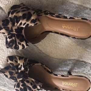 Leopard fabric mules with asymetrical bow